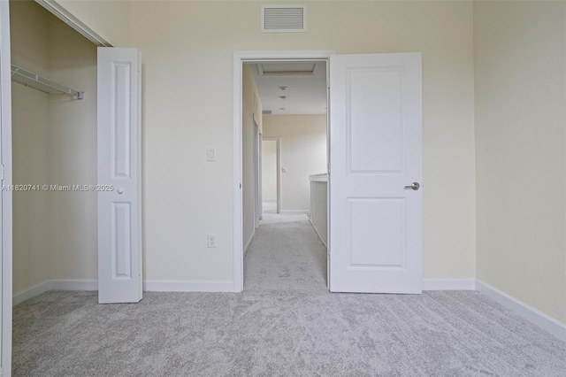 3411 W 112th Ter, Hialeah, FL 33018 - unfurnished bedroom with carpet, attic access, and a closet