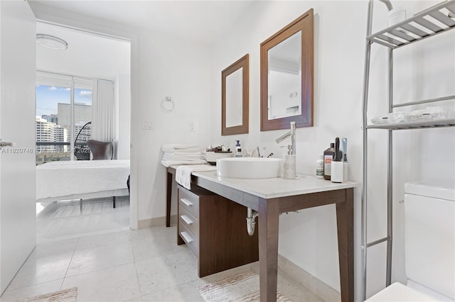 495 Brickell Ave Unit 905, Miami, FL 33131 - ensuite bathroom featuring vanity and tile patterned flooring