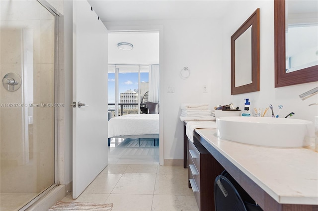 495 Brickell Ave Unit 905, Miami, FL 33131 - ensuite bathroom with a shower stall, vanity, and tile patterned floors