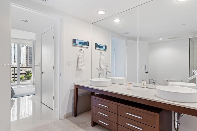 495 Brickell Ave Unit 905, Miami, FL 33131 - full bathroom featuring double vanity, tile patterned floors, recessed lighting, ensuite bathroom, and a bidet