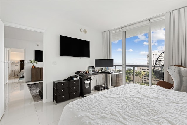 495 Brickell Ave Unit 905, Miami, FL 33131 - bedroom featuring tile patterned floors and expansive windows