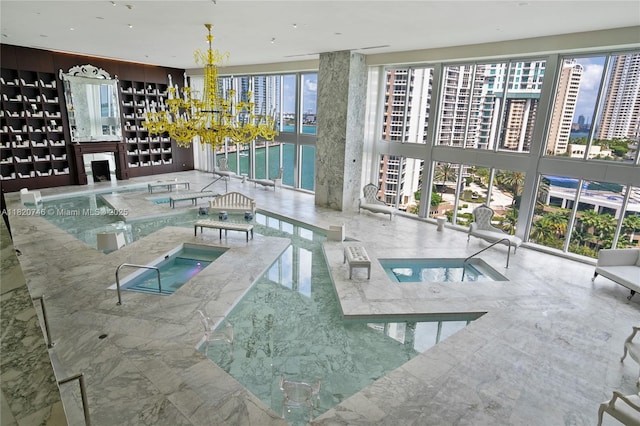 495 Brickell Ave Unit 905, Miami, FL 33131 - view of pool with a water view and a chandelier