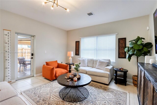 148 NE 36th Avenue Rd, Homestead, FL 33033 - living room featuring light tile patterned floors and a chandelier