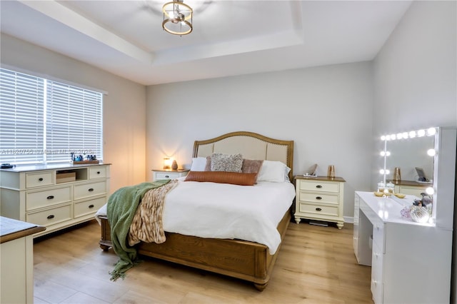 148 NE 36th Avenue Rd, Homestead, FL 33033 - bedroom featuring light wood finished floors and a tray ceiling