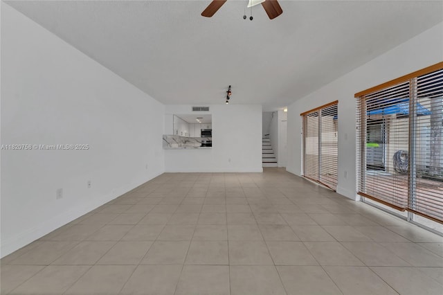14388 SW 96th Ln, Miami, FL 33186 - unfurnished living room with ceiling fan, stairs, and light tile patterned floors