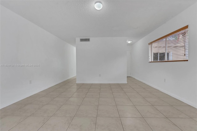 14388 SW 96th Ln, Miami, FL 33186 - spare room featuring a textured ceiling
