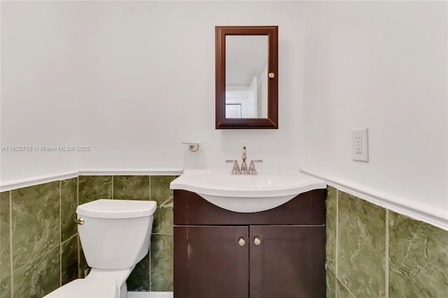 14388 SW 96th Ln, Miami, FL 33186 - bathroom featuring vanity, a wainscoted wall, and tile walls