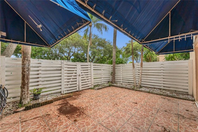 14388 SW 96th Ln, Miami, FL 33186 - fenced backyard featuring a patio area
