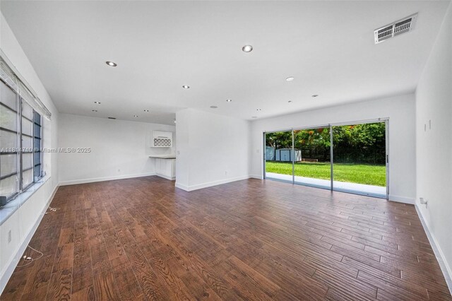 9221 SW 167th Ter, Palmetto Bay, FL 33157 - unfurnished living room with wood finished floors and recessed lighting