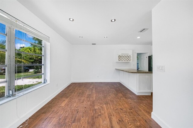 9221 SW 167th Ter, Palmetto Bay, FL 33157 - empty room featuring healthy amount of natural light, dark wood-style floors, and recessed lighting