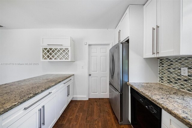 9221 SW 167th Ter, Palmetto Bay, FL 33157 - kitchen with freestanding refrigerator, dishwasher, light stone countertops, dark wood-style flooring, and white cabinetry