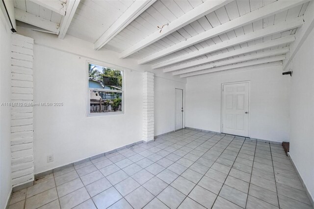 9221 SW 167th Ter, Palmetto Bay, FL 33157 - unfurnished room featuring a wood ceiling with exposed beams and light tile patterned flooring