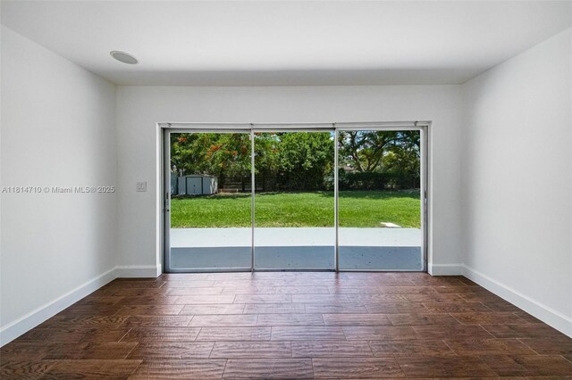 9221 SW 167th Ter, Palmetto Bay, FL 33157 - unfurnished room with dark wood-style flooring and baseboards