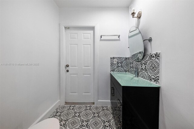 9221 SW 167th Ter, Palmetto Bay, FL 33157 - half bathroom featuring vanity and tile patterned flooring