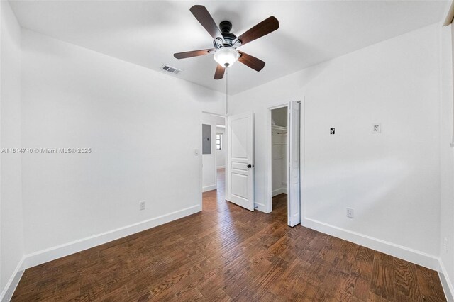 9221 SW 167th Ter, Palmetto Bay, FL 33157 - empty room with ceiling fan, electric panel, and dark wood-type flooring