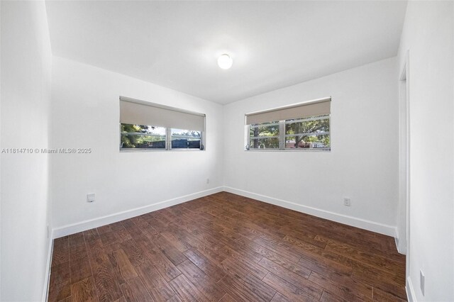 9221 SW 167th Ter, Palmetto Bay, FL 33157 - unfurnished room featuring baseboards and wood finished floors