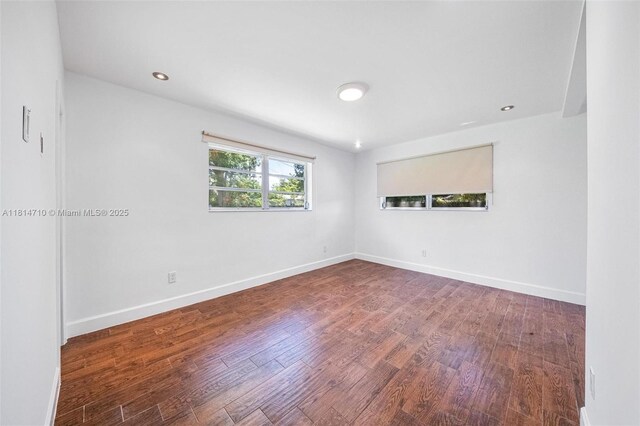 9221 SW 167th Ter, Palmetto Bay, FL 33157 - empty room with wood finished floors and baseboards