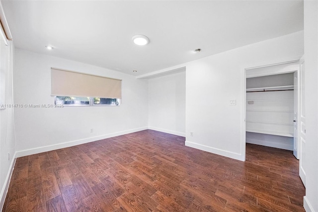 9221 SW 167th Ter, Palmetto Bay, FL 33157 - unfurnished bedroom featuring wood finished floors, a spacious closet, and a closet