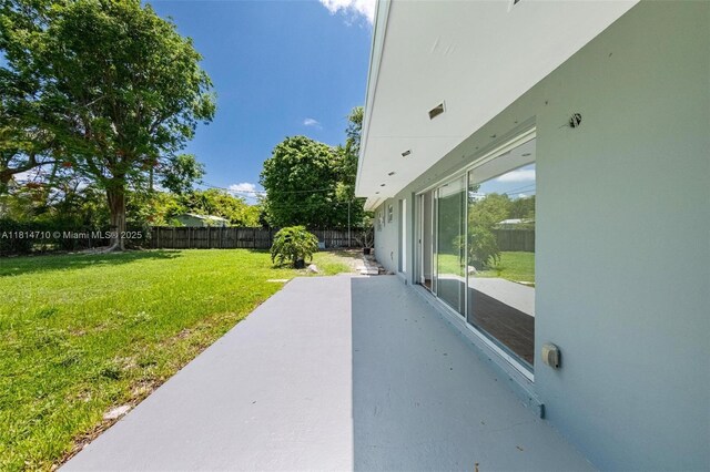 9221 SW 167th Ter, Palmetto Bay, FL 33157 - fenced backyard featuring a patio
