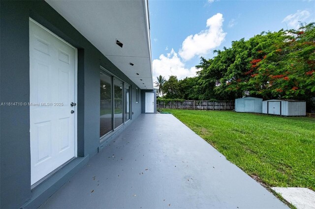 9221 SW 167th Ter, Palmetto Bay, FL 33157 - view of patio / terrace featuring a storage unit