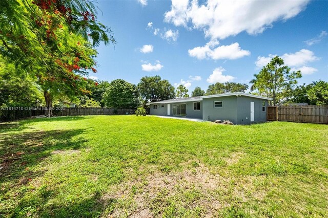 9221 SW 167th Ter, Palmetto Bay, FL 33157 - fenced backyard with a patio