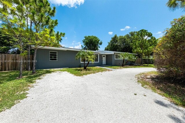 9221 SW 167th Ter, Palmetto Bay, FL 33157 - ranch-style house with driveway and stucco siding