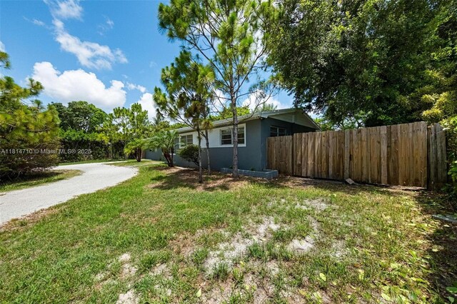 9221 SW 167th Ter, Palmetto Bay, FL 33157 - view of yard with asphalt driveway and a garage