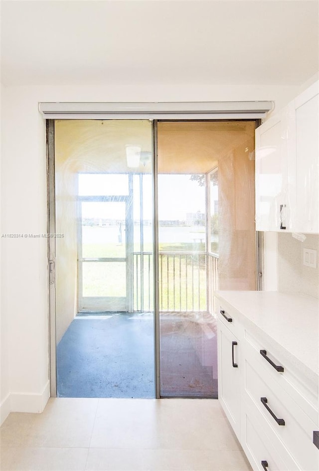 1750 NE 191st St Unit 100-1, Miami, FL 33179 - kitchen with white cabinets and light countertops