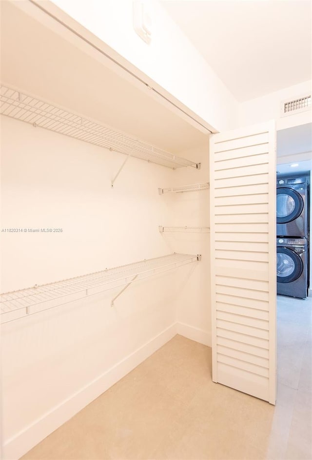 1750 NE 191st St Unit 100-1, Miami, FL 33179 - walk in closet with stacked washer / drying machine
