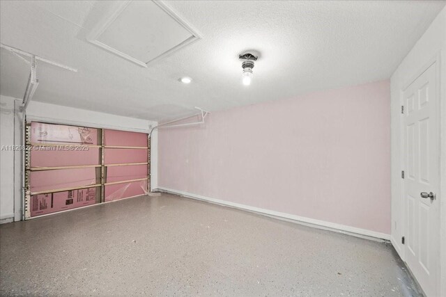 18125 Wintergarden Ave, Port Charlotte, FL 33948 - garage featuring baseboards