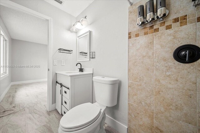 18125 Wintergarden Ave, Port Charlotte, FL 33948 - bathroom with vanity, marble finish floors, and tiled shower
