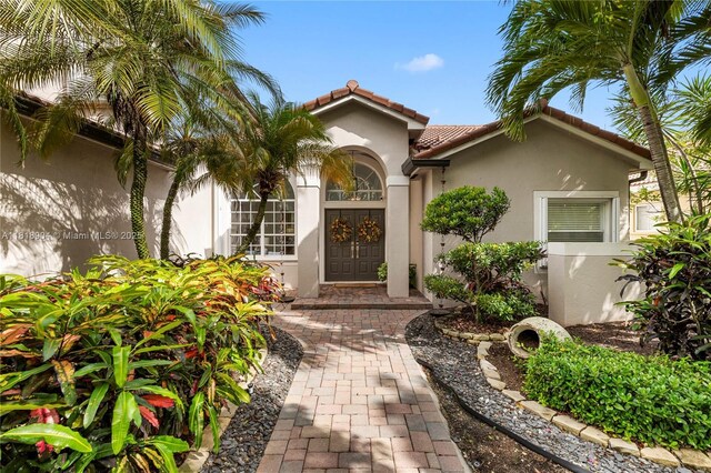 1971 Landing Way, Weston, FL 33326 - entrance to property featuring stucco siding and a tiled roof