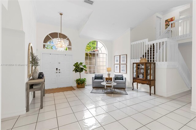 1971 Landing Way, Weston, FL 33326 - entrance foyer with stairs, a chandelier, a towering ceiling, light tile patterned floors, and crown molding