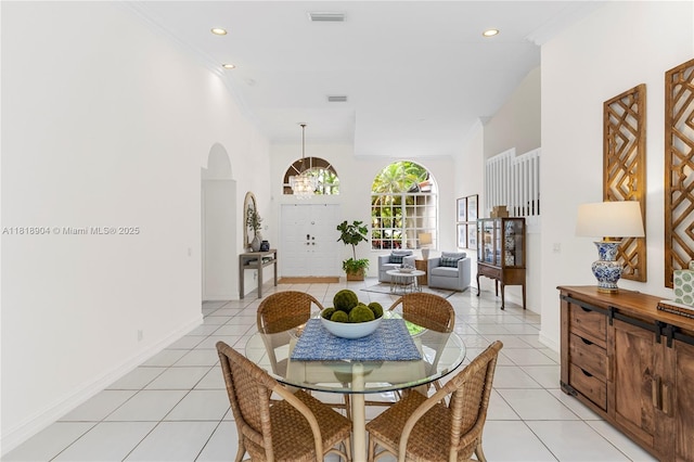 1971 Landing Way, Weston, FL 33326 - dining room with light tile patterned floors, arched walkways, recessed lighting, a chandelier, and ornamental molding
