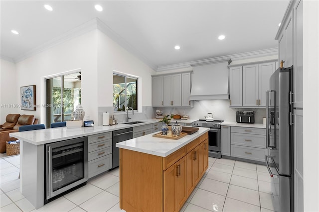 1971 Landing Way, Weston, FL 33326 - kitchen featuring appliances with stainless steel finishes, custom range hood, gray cabinetry, beverage cooler, and backsplash
