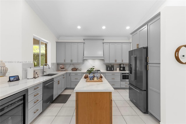 1971 Landing Way, Weston, FL 33326 - kitchen featuring high end refrigerator, gray cabinetry, beverage cooler, stainless steel dishwasher, and ornamental molding