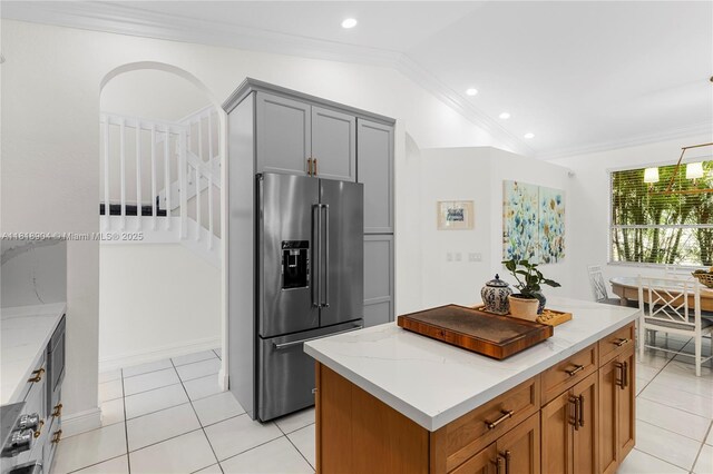 1971 Landing Way, Weston, FL 33326 - kitchen with high end refrigerator, lofted ceiling, recessed lighting, light tile patterned floors, and gray cabinetry
