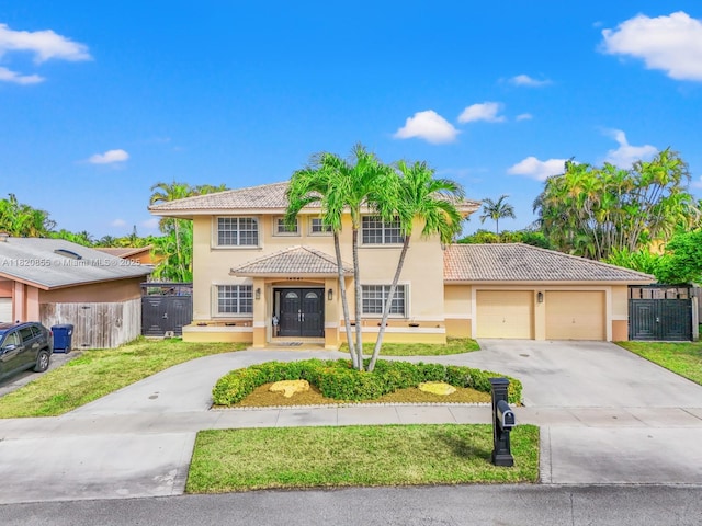12821 SW 148th St Rd, Miami, FL 33186 - view of front of property featuring a tile roof, stucco siding, concrete driveway, and an attached garage