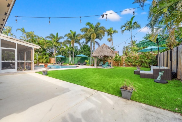 12821 SW 148th St Rd, Miami, FL 33186 - fenced backyard with a gazebo, a sunroom, and a patio area