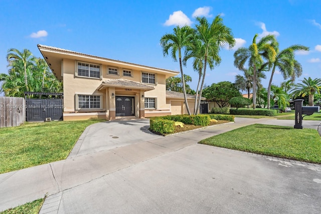 12821 SW 148th St Rd, Miami, FL 33186 - mediterranean / spanish house with stucco siding, driveway, and a tiled roof