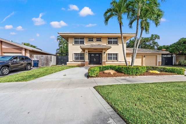 12821 SW 148th St Rd, Miami, FL 33186 - view of front facade featuring stucco siding, driveway, a tile roof, and a gate