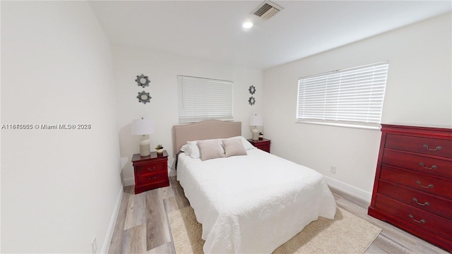 2116 NW 3rd Ave, Wilton Manors, FL 33311 - bedroom with light wood finished floors and baseboards