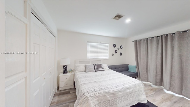 2116 NW 3rd Ave, Wilton Manors, FL 33311 - bedroom with light wood-type flooring and a closet