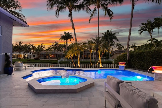 10985 Canary Island Ct, Plantation, FL 33324 - pool at dusk featuring a patio area, a fenced backyard, an in-ground hot tub, and an outdoor living space
