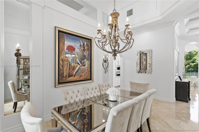 10985 Canary Island Ct, Plantation, FL 33324 - dining area featuring a chandelier, arched walkways, crown molding, and light marble finish floors