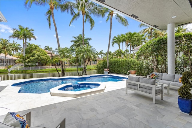 10985 Canary Island Ct, Plantation, FL 33324 - view of swimming pool with an outdoor hangout area, a patio, an in-ground hot tub, and a fenced backyard
