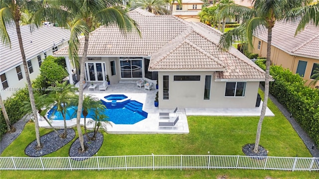 10985 Canary Island Ct, Plantation, FL 33324 - rear view of property with a fenced backyard, stucco siding, a tile roof, and a patio area