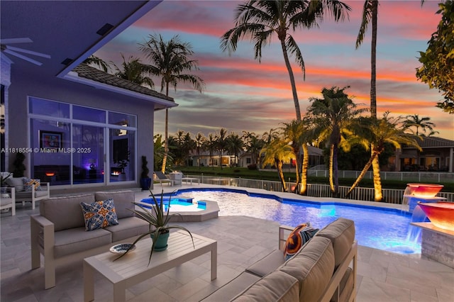 10985 Canary Island Ct, Plantation, FL 33324 - pool at dusk with an outdoor living space, a patio, and a fenced backyard