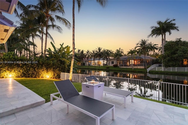 10985 Canary Island Ct, Plantation, FL 33324 - view of patio / terrace with a water view and a fire pit
