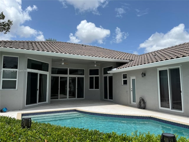 1290 Ginger Cir, Weston, FL 33326 - back of house with a tile roof, ceiling fan, stucco siding, and an outdoor pool